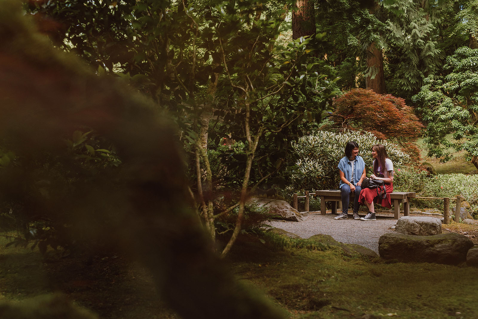 Couple sitting down on a bench - Portland Japanese Garden Proposal