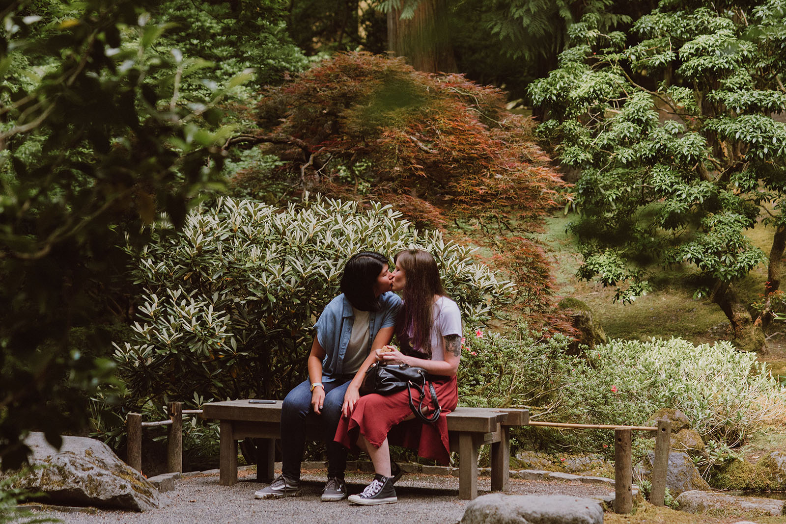 Couple kissing after getting engaged - Portland Japanese Garden Proposal