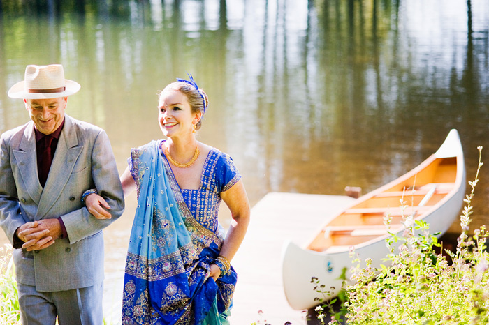 Father of Bride, Robin Cody, arrives in canoe with Bride - Bridal Veil Lakes wedding - Portland Oregon