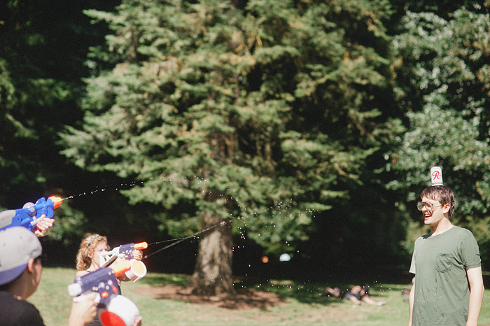 Portland Lifestyle Photographer - Water Gun Fight in Laurelhurst Park