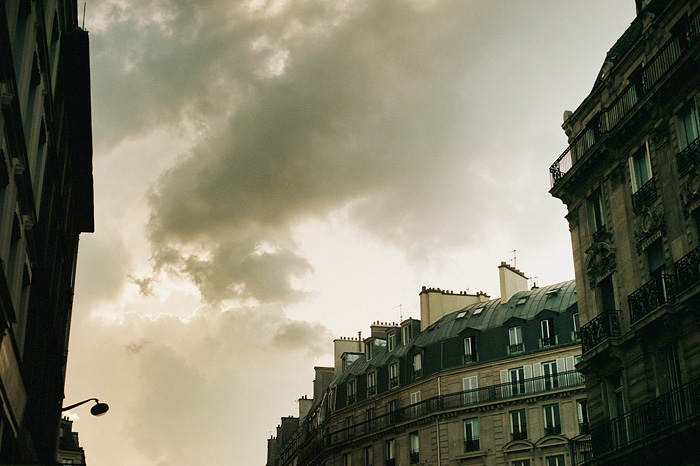 Paris wedding photographer - Clouds and typical Parisian buildings off Rue Saint-Denis