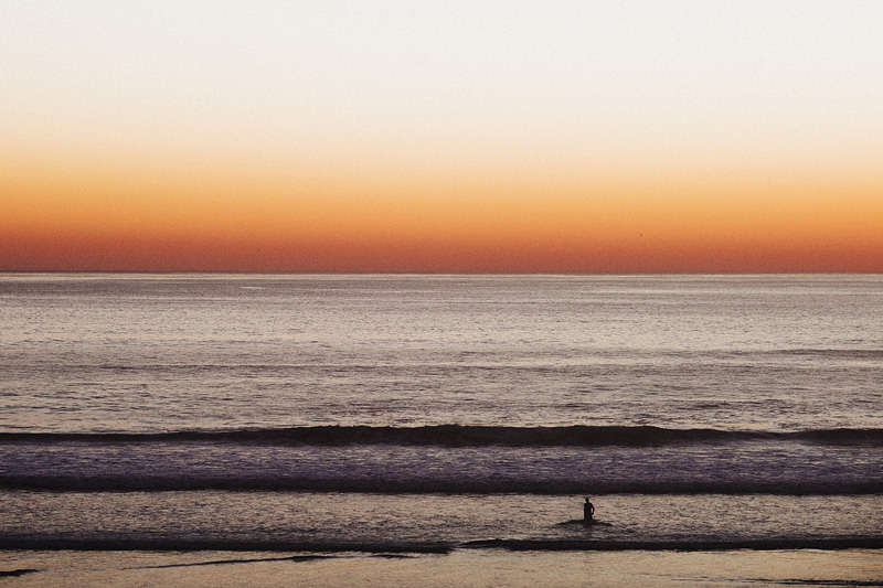 Tillamook Wedding Photographer - Man standing in the ocean at sunset - Oceanside, OR