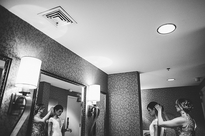 St Petersburg Wedding Photographer - Bridesmaids touching up in the Vinoy Renaissance Hotel bathrooms