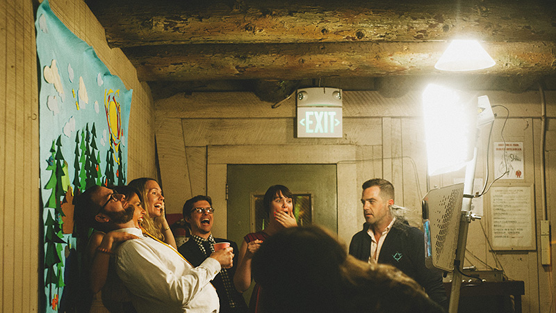 Guests enjoying the Photo Booth | Kate & Will's Camp Seely Wedding | Kim Smith-Miller