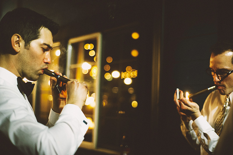 Groom and Groomsmen smoking cigars in the courtyard - Sodo Park Wedding Photographer
