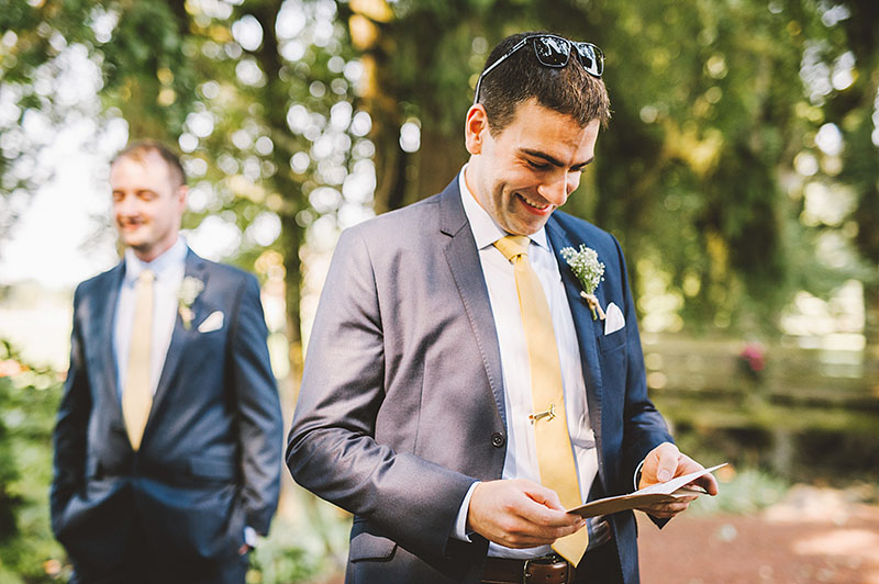 Groom reading a card from the Bride - Rustic Postlewait's Wedding in Canby, OR