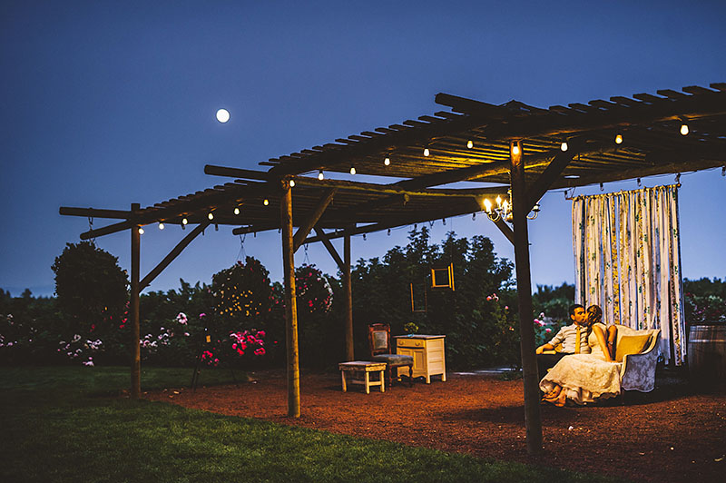 Bride and Groom sharing a kiss under the full moon - Rustic Postlewait's Wedding in Canby, OR