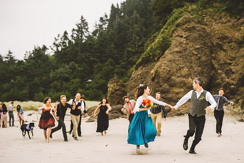 Bride and Groom running from zombie guests