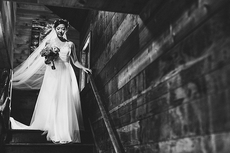 Bride walking down stairs at her Nature Bridge Wedding