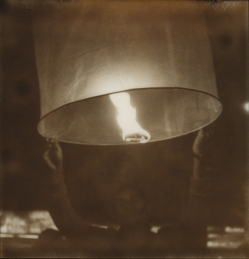 Sending off a wish lantern for Loi Krathong | SLR680 Polaroid