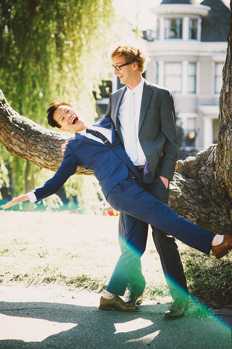 Foreign Cinema Wedding - Grooms goofing off in Alamo Square