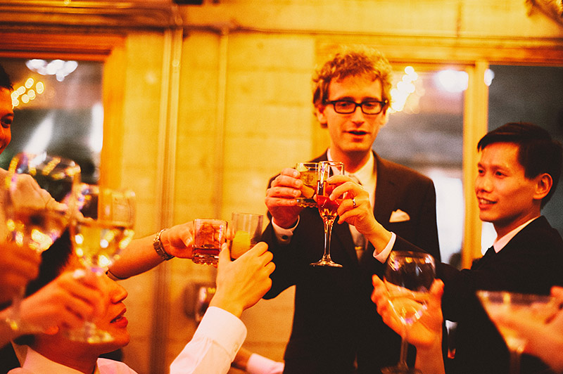 Grooms toasting with guests at a Foreign Cinema wedding