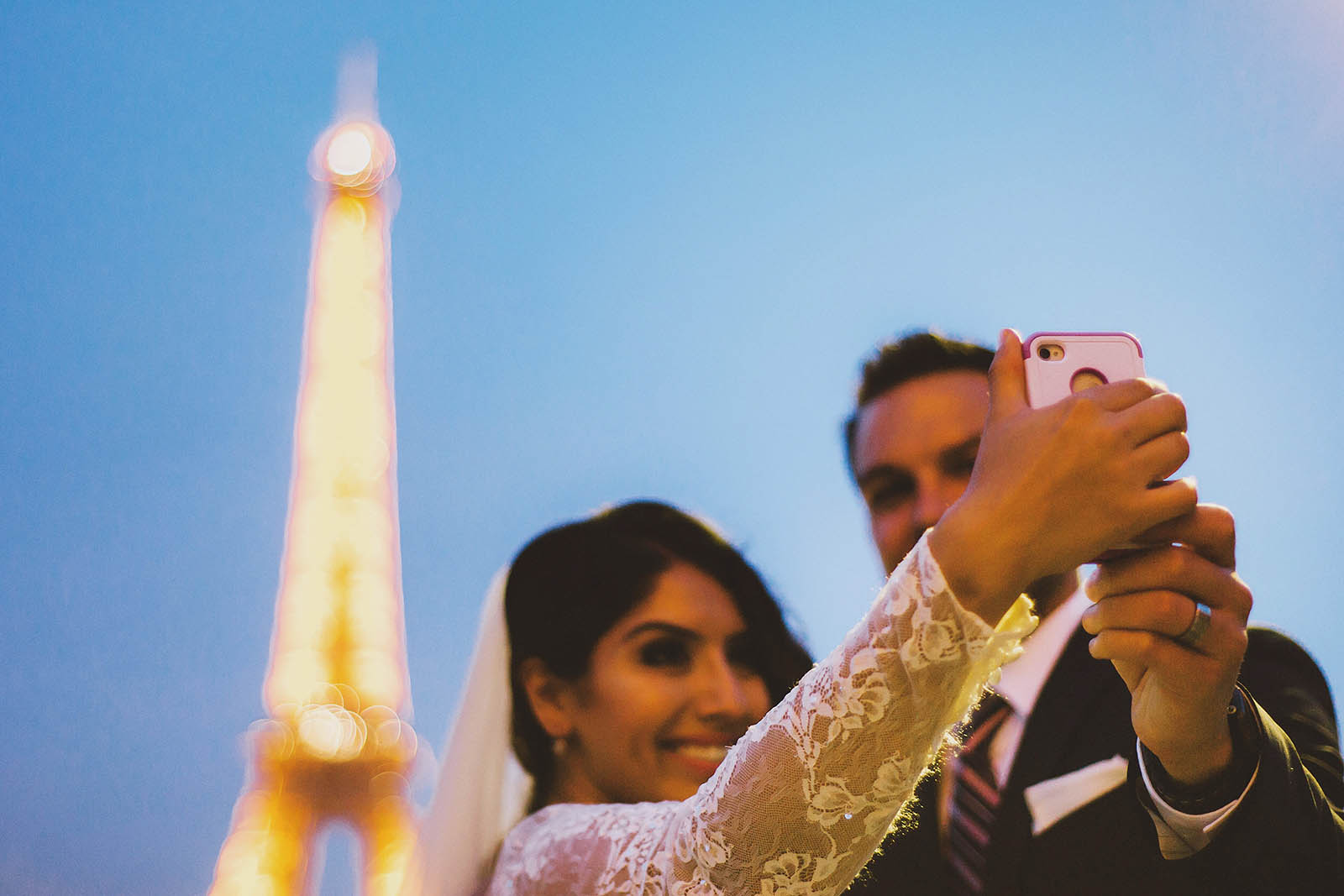 Taking selfies at the Eiffel Tower | Springtime Paris Elopement at Parc des Buttes Chaumont