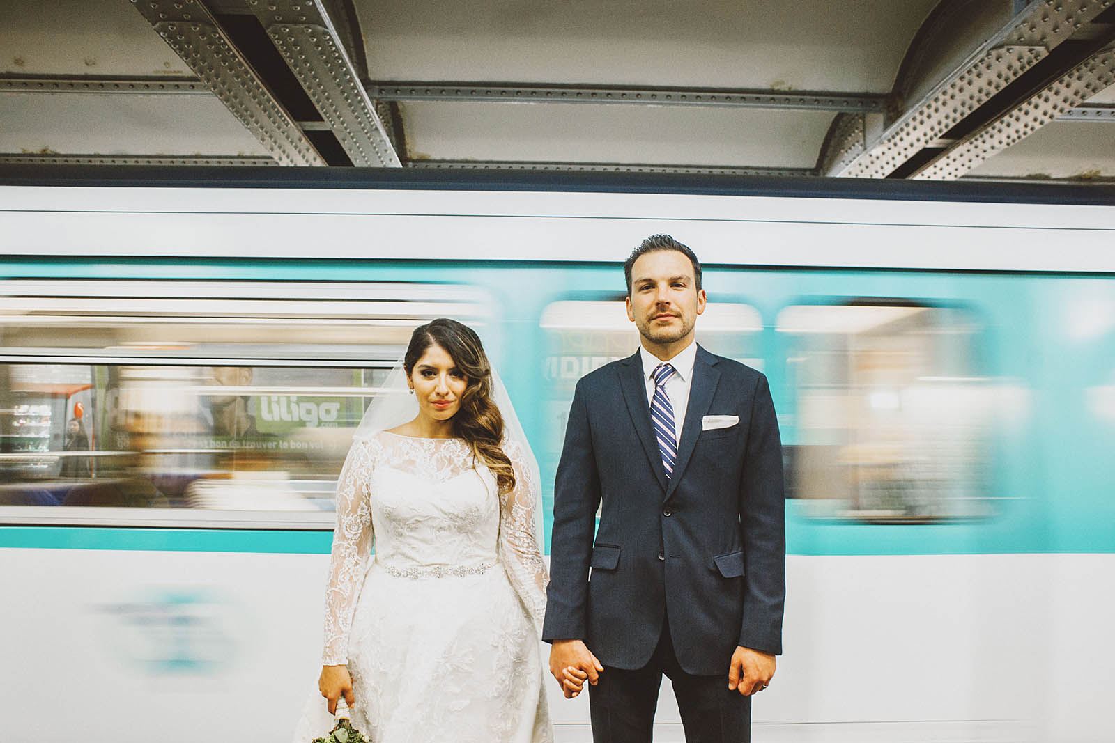 Bride and Groom portrait in front of a Metro train | Springtime Paris Elopement at Parc des Buttes Chaumont