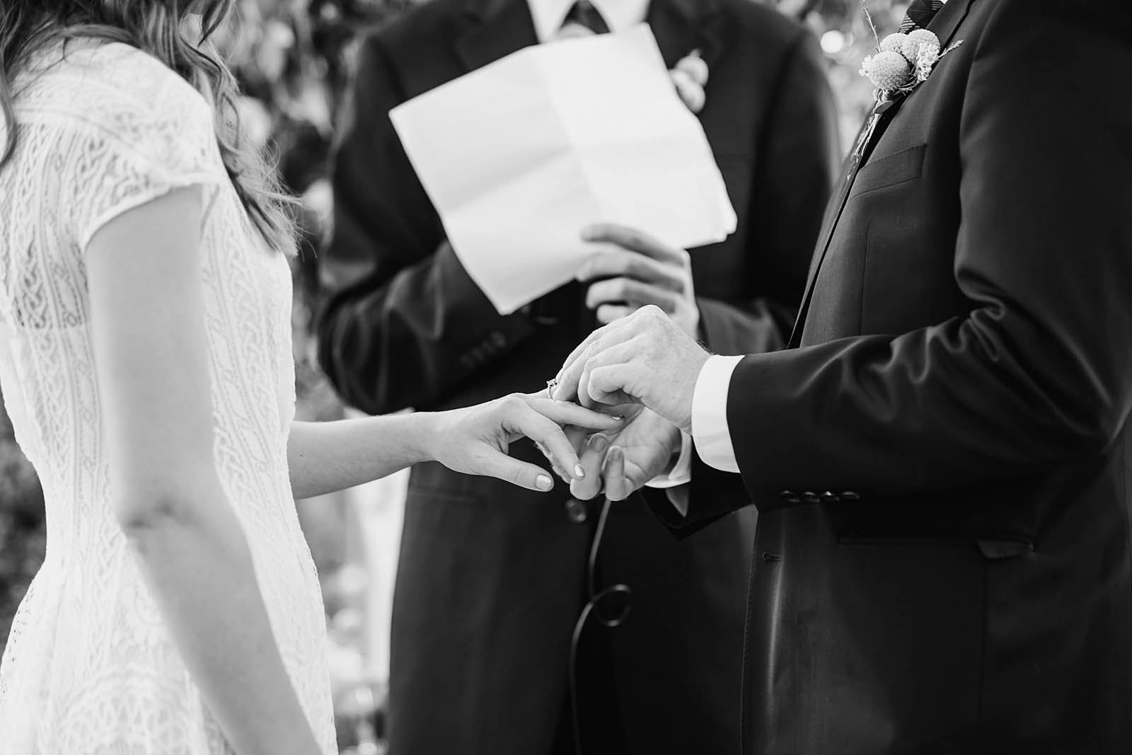 Bride and groom exchanging rings | Castaway Portland Wedding