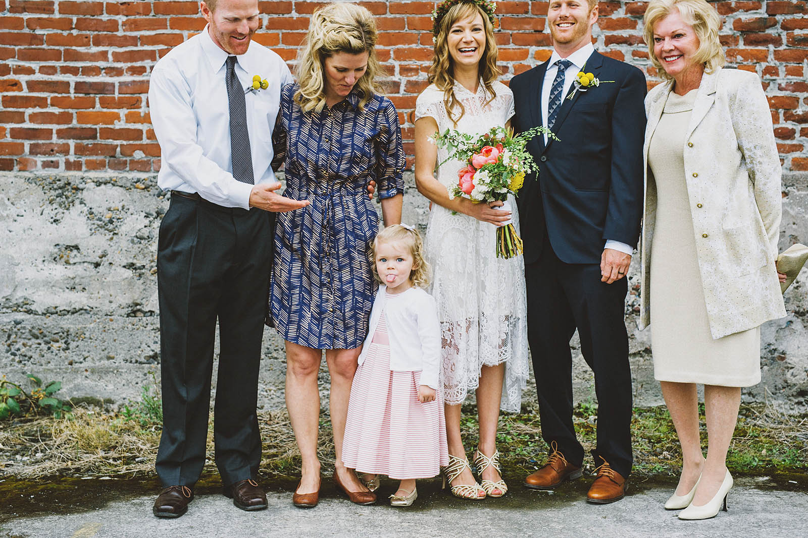 Little girl sticking out her tongue during formals | Castaway Portland Wedding
