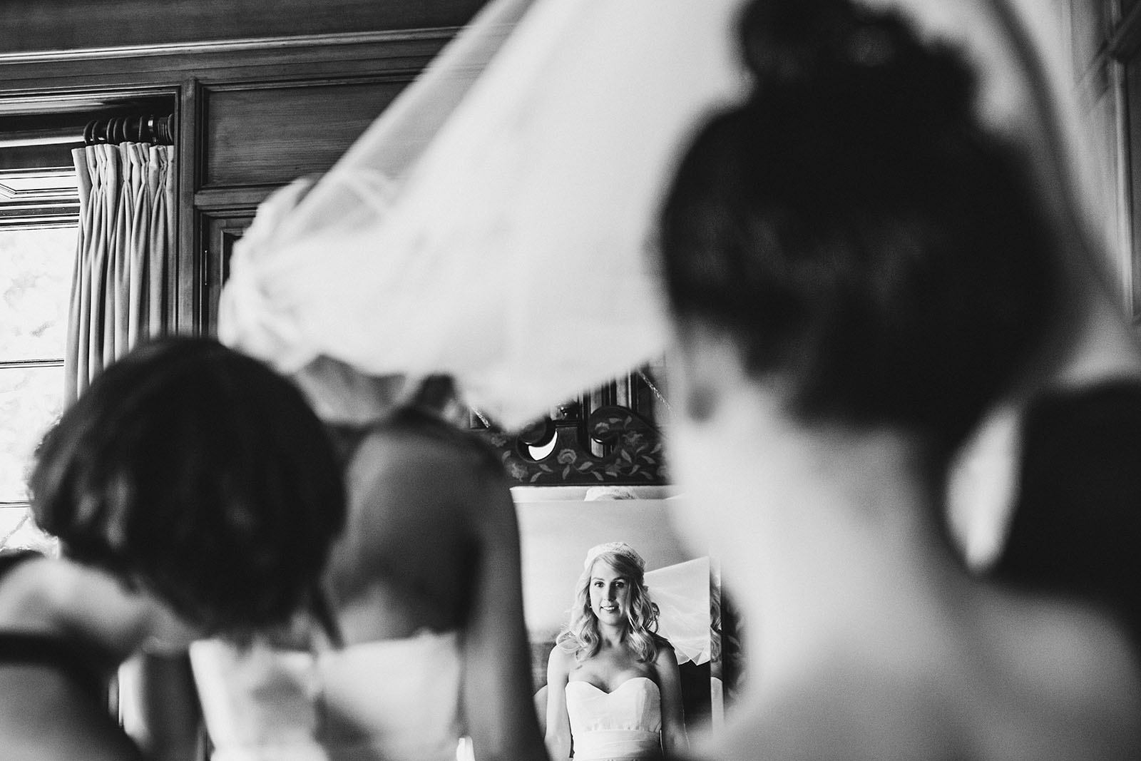 Bridesmaids helping bride get into her dress | Portland Town Club Wedding