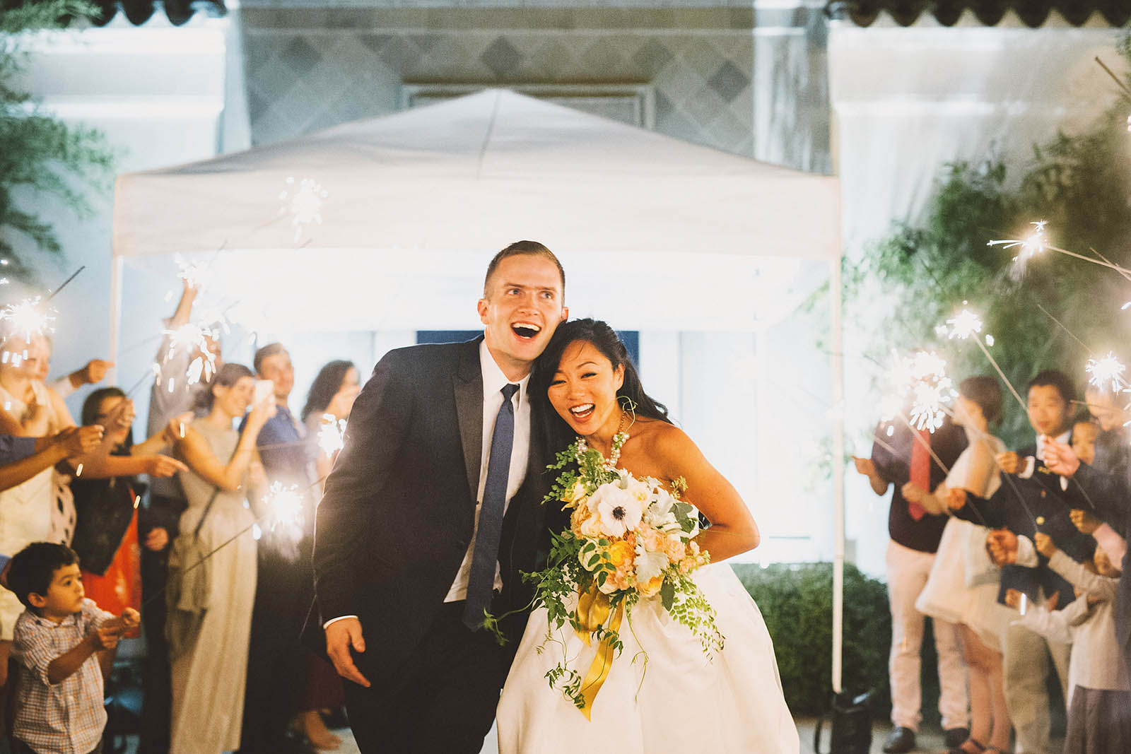 Bride and groom running down their sparkler exit | Lan Su Chinese Garden Wedding