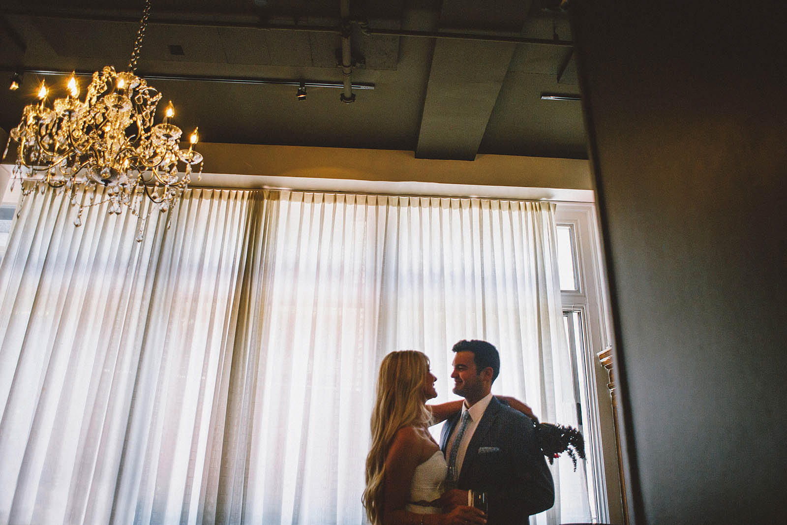 Couple sharing some champagne | San Francisco City Hall Wedding