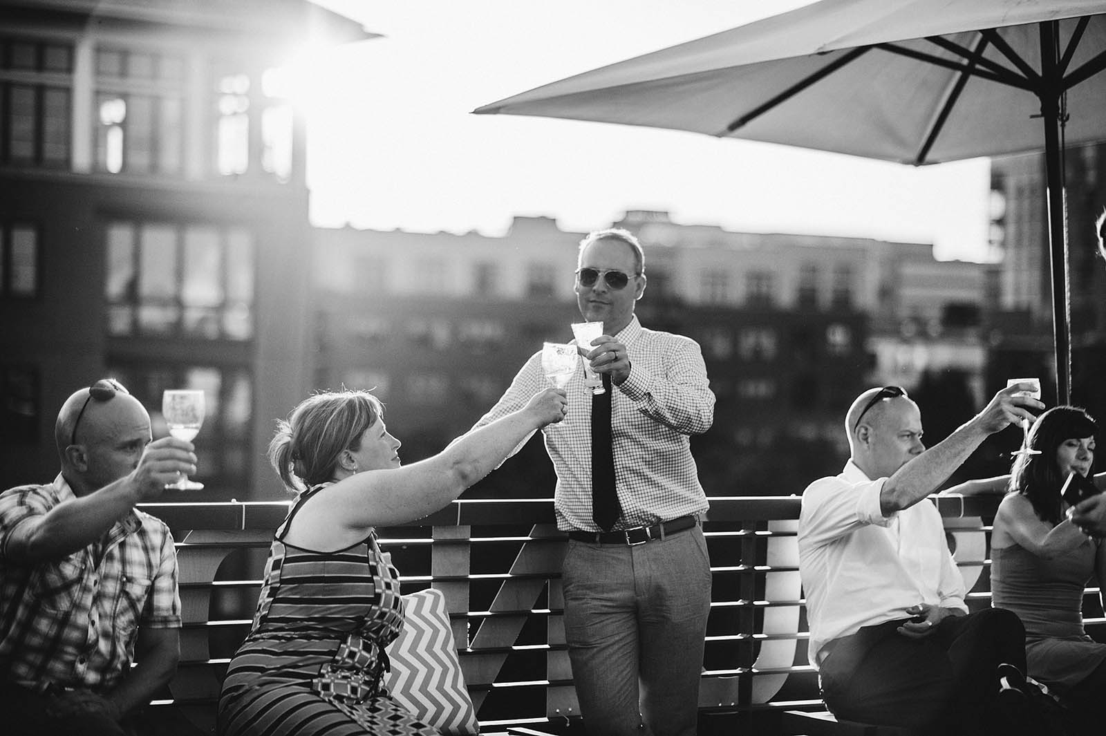 Guests toasting during the speeches | Ecotrust Rooftop Wedding in Downtown PDX
