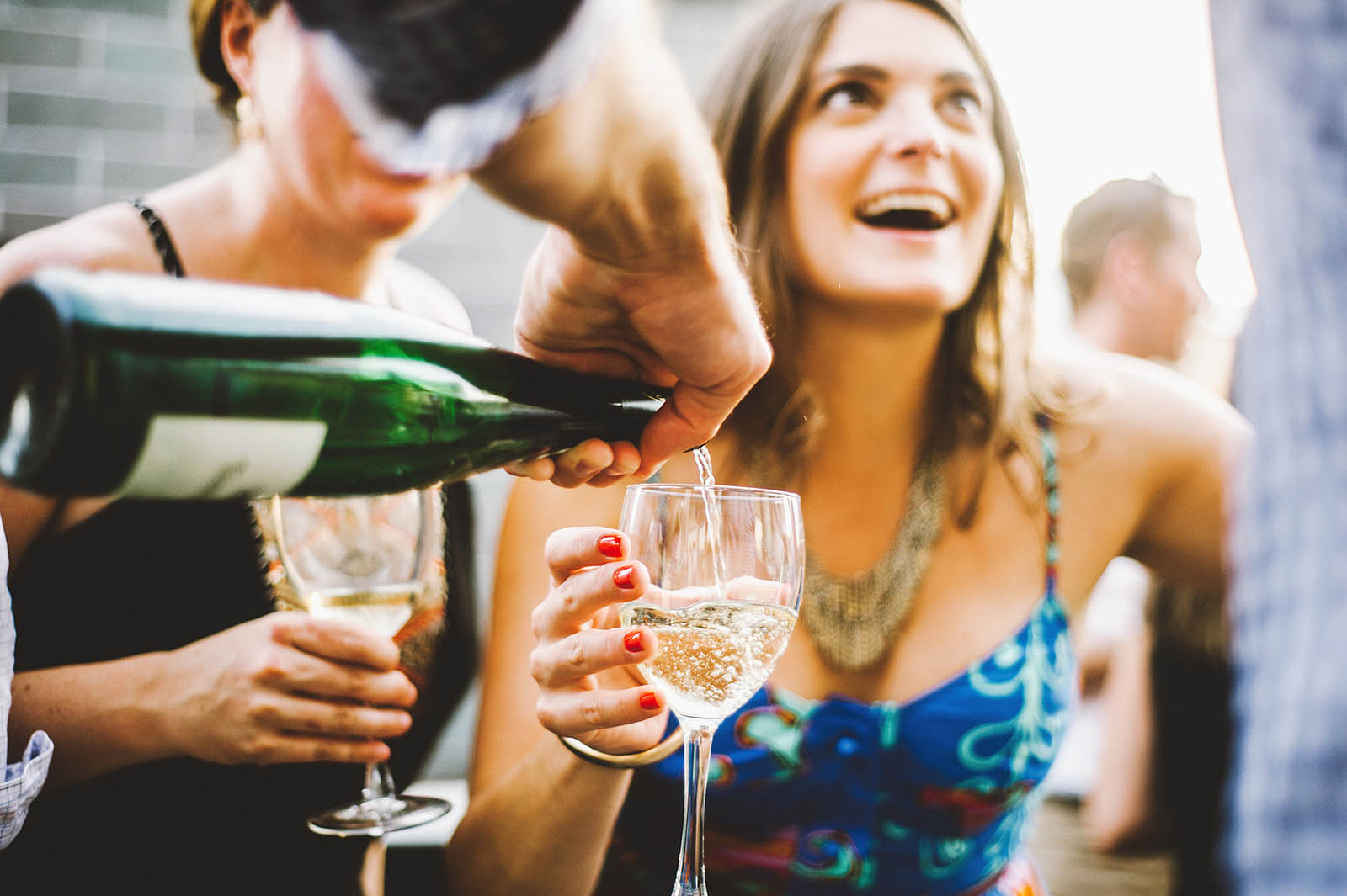 Wedding guests pouring champagne | Ecotrust Rooftop Wedding in Downtown PDX