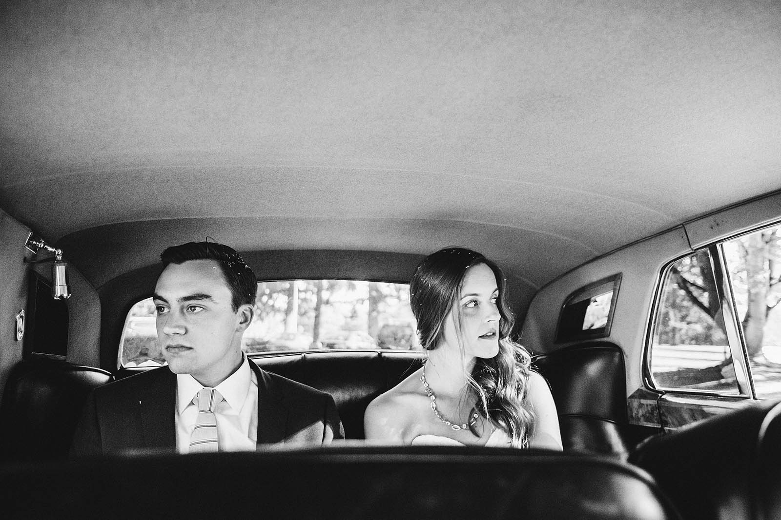 Bride and Groom riding in a car | Fort Vancouver Wedding in Washington