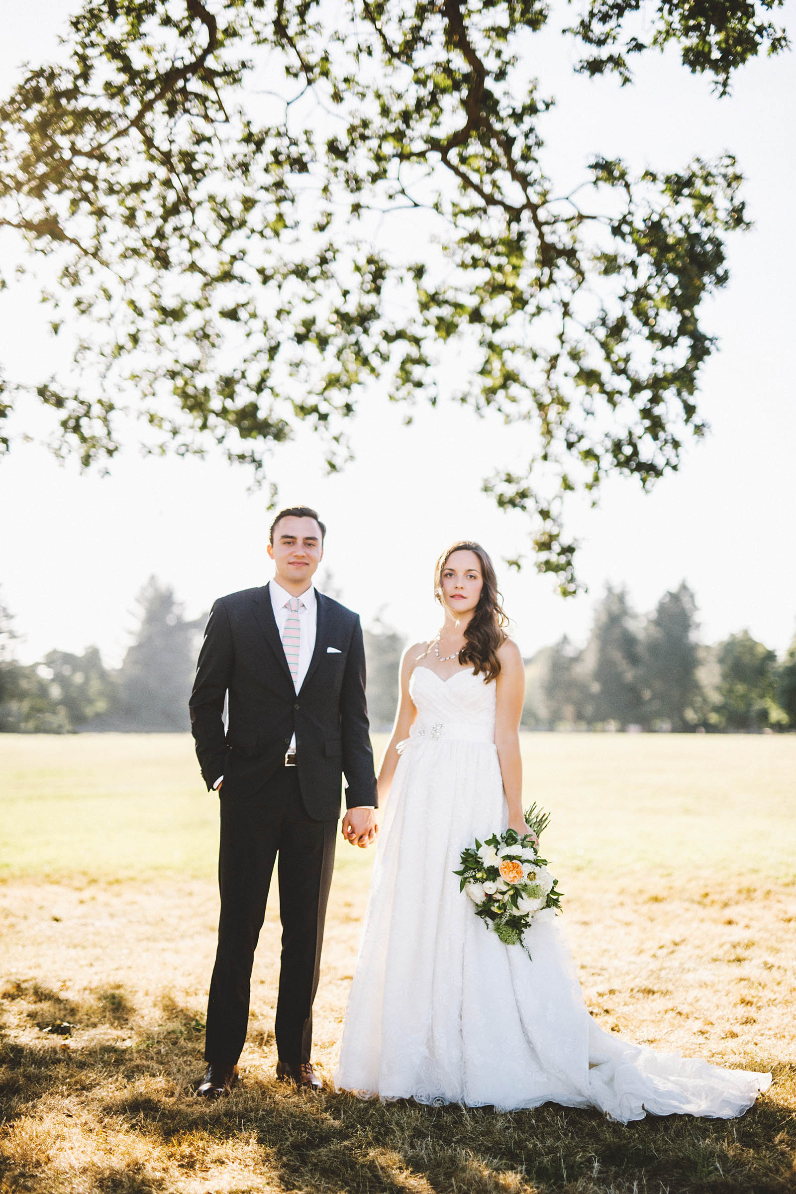 Bride and Groom standing under a tree | Fort Vancouver Wedding in Washington