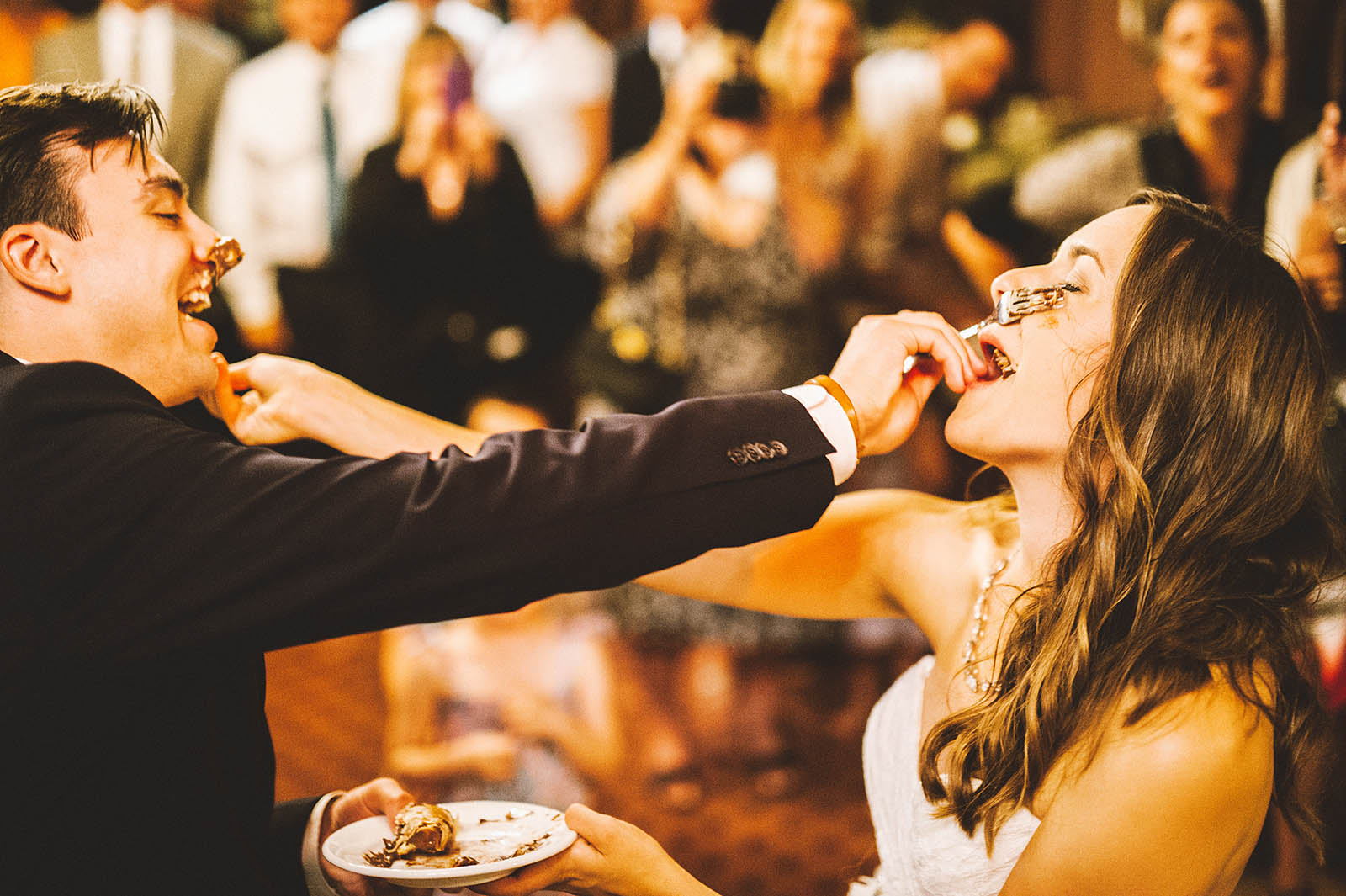 Bride and Groom shoving chocolate pie in each other's faces | Fort Vancouver Wedding in Washington