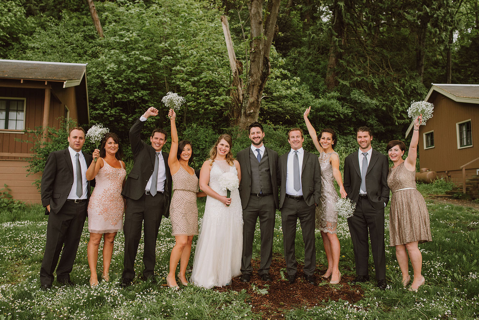 Wedding party cheering at Cama Beach State Park | Camano Island Wedding