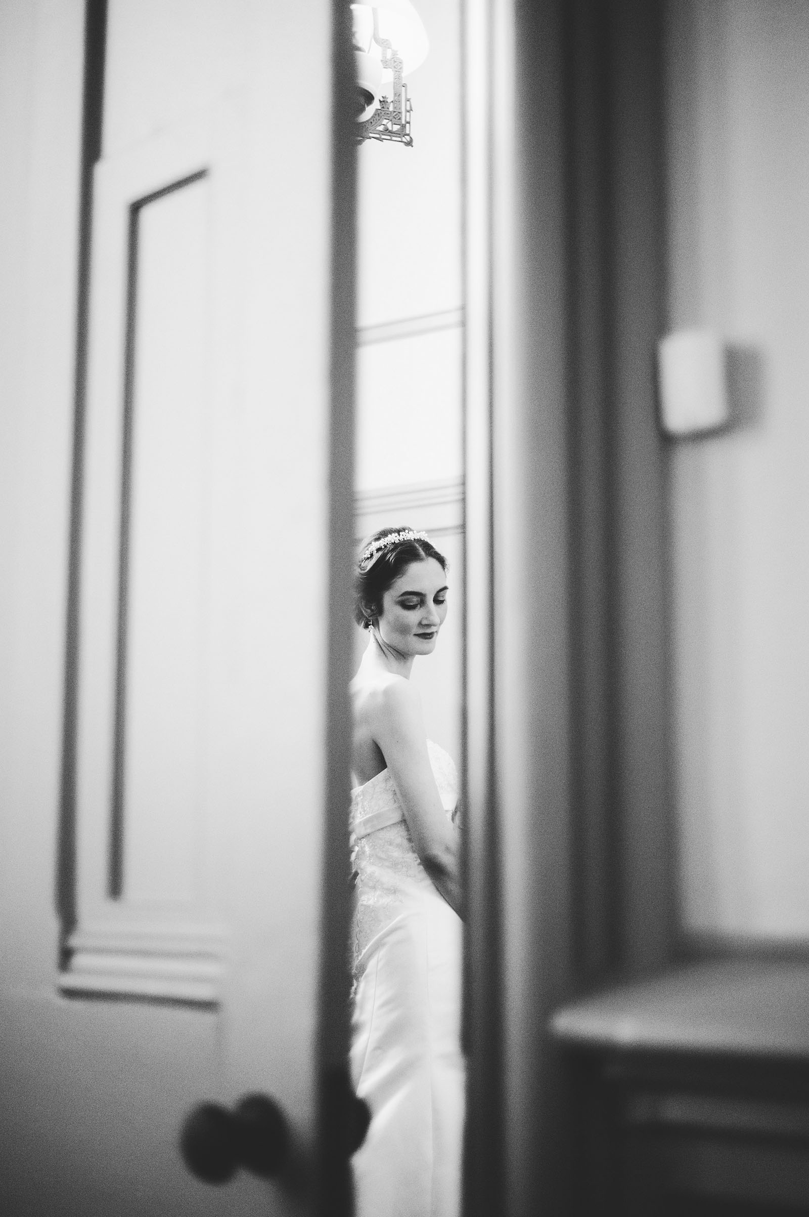 Portrait of bride dressing through doorway | Old Church Wedding Photos