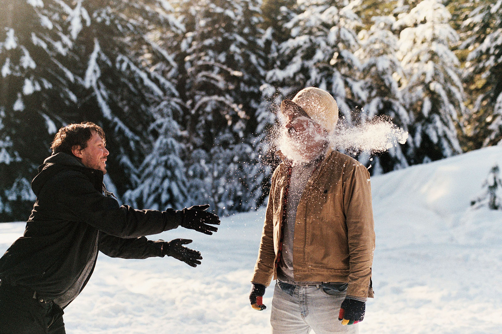 Amos throwing snow on Miles in Trout Lake, WA | Contax Aria