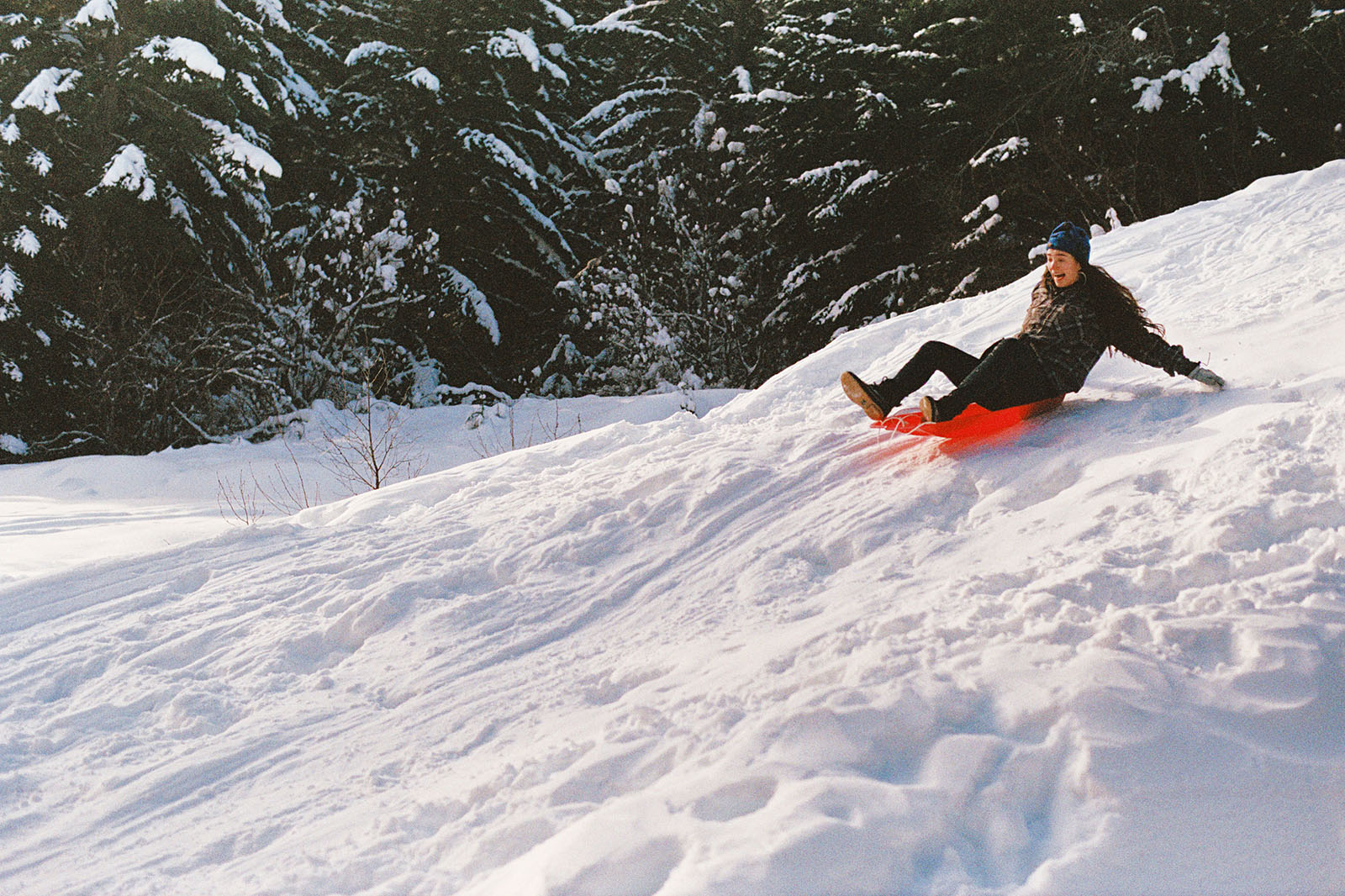 Richelle sledding down the snow in Trout Lake, WA | Contax Aria