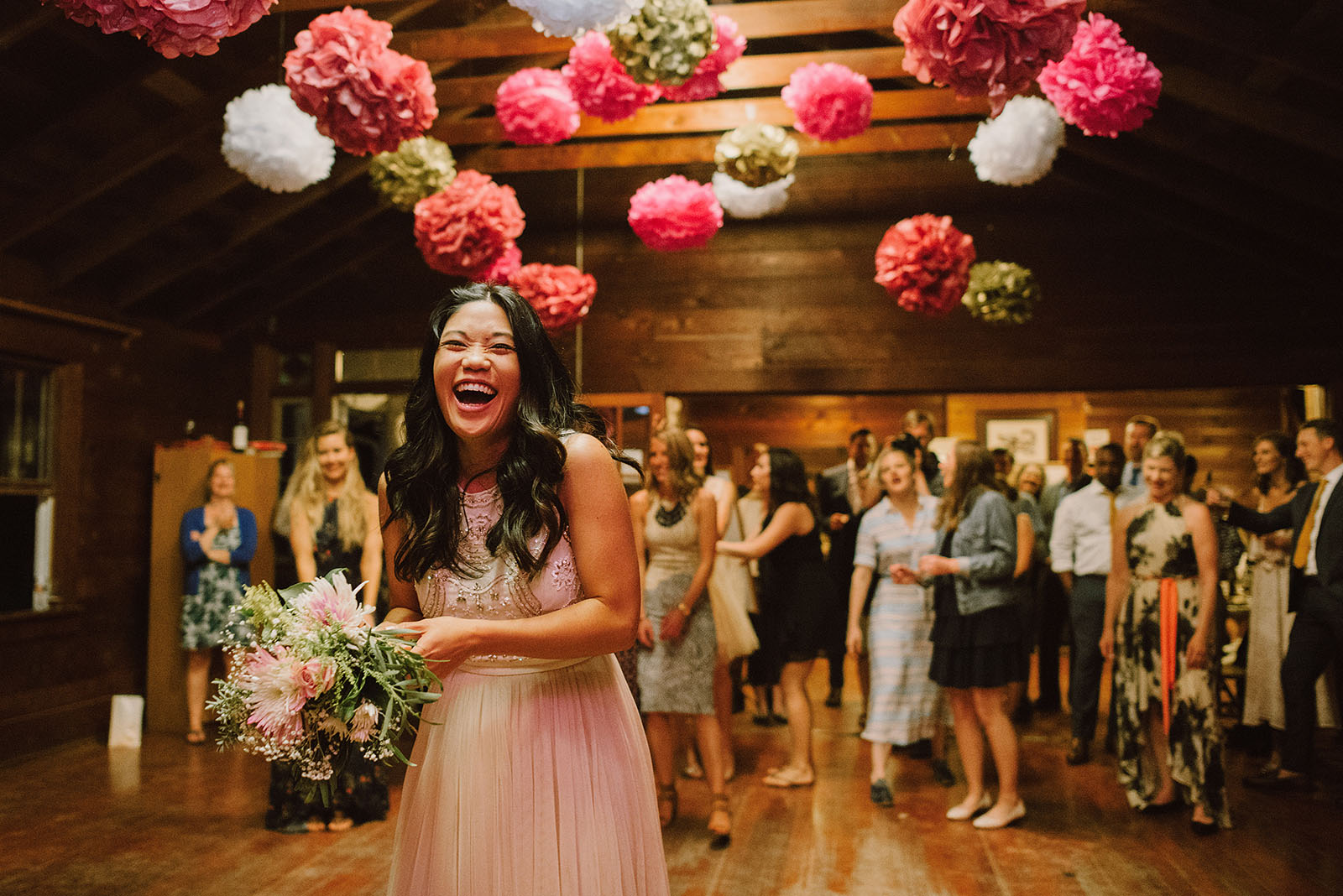 Bride laughing during the bouquet toss | Olympic National Park Wedding