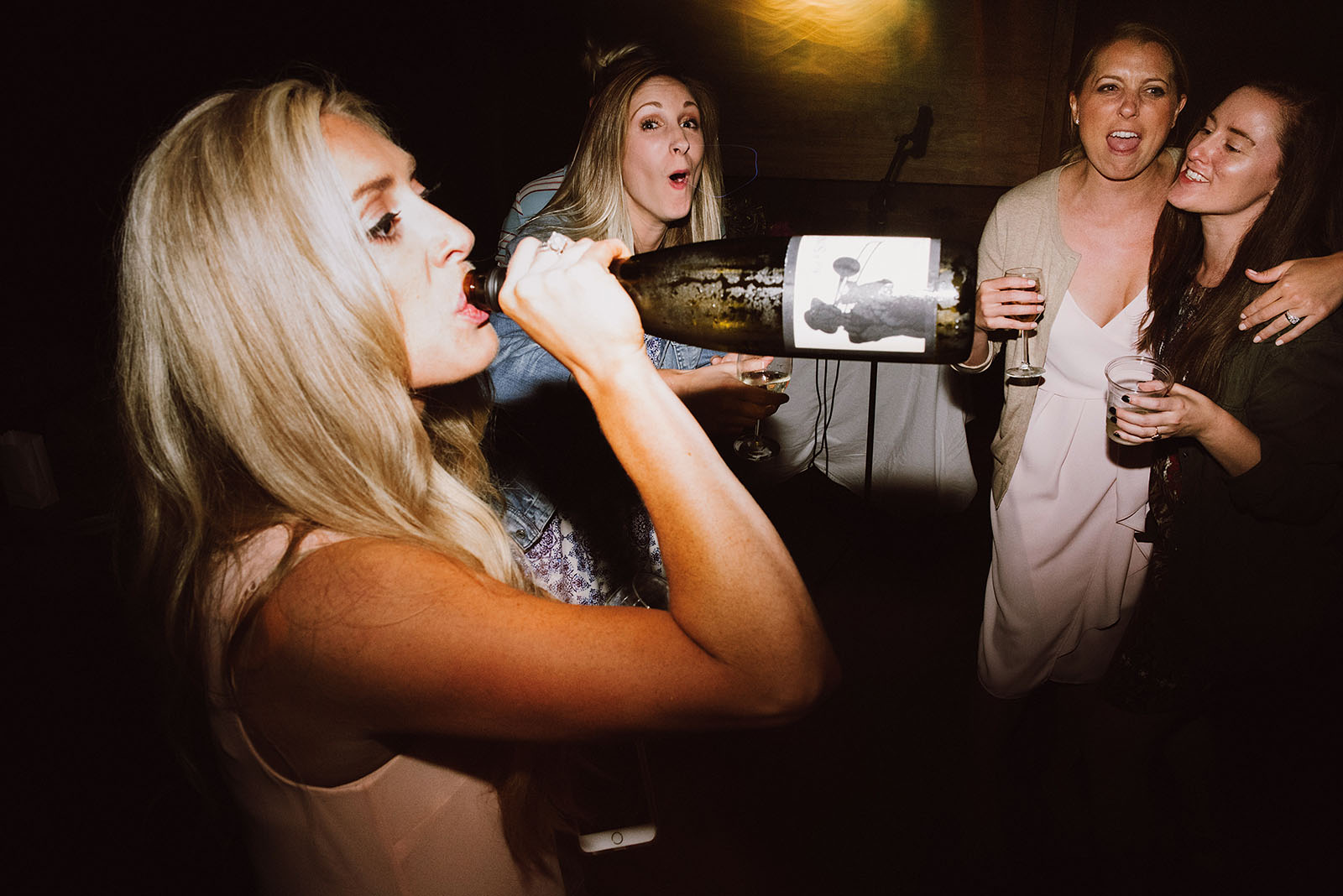 Bridesmaid chugging wine at the reception in Nature Bridge | Olympic National Park Wedding