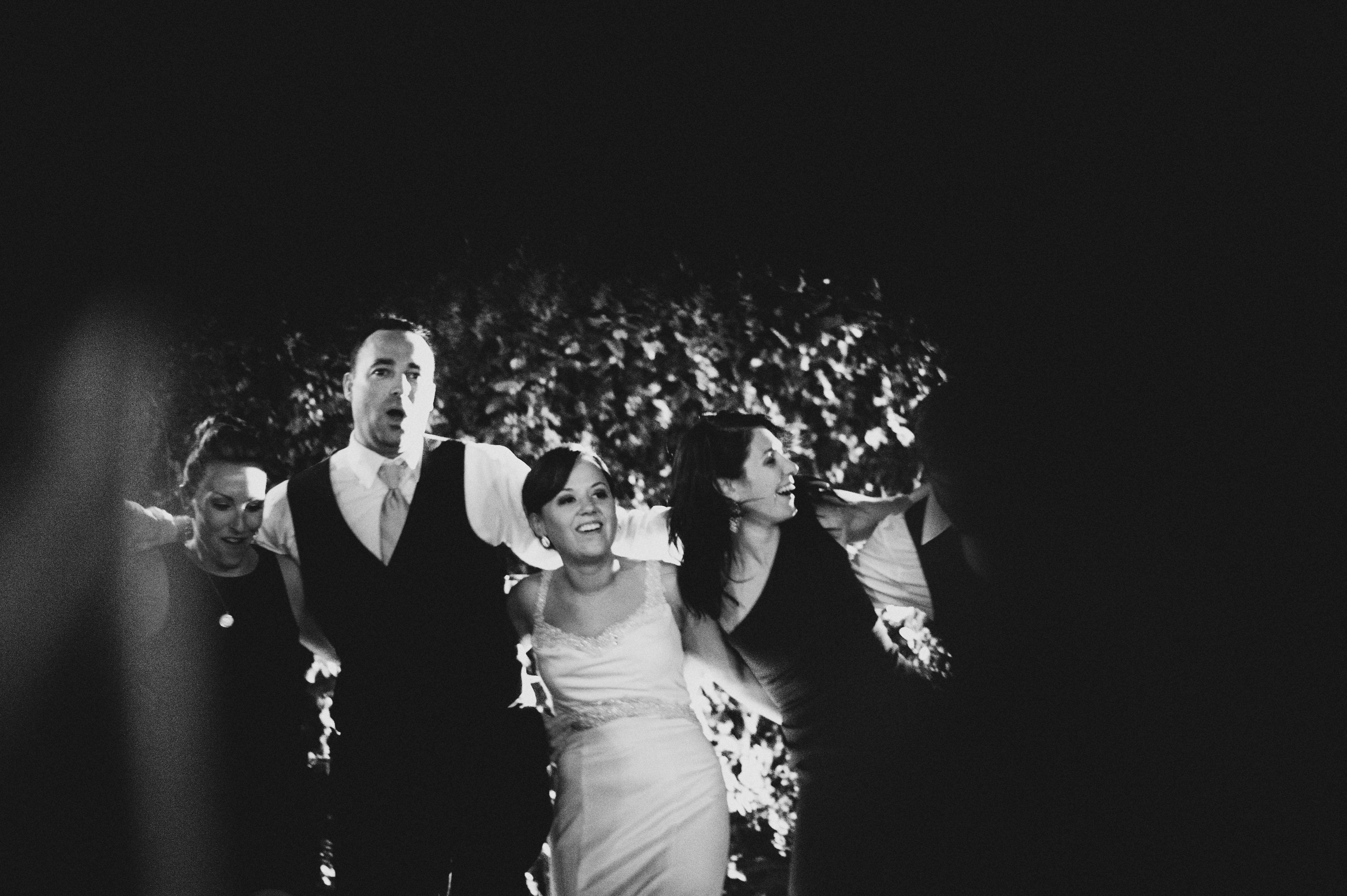Bride and Groom singing with guests in a circle | Sacramento Firehouse Wedding