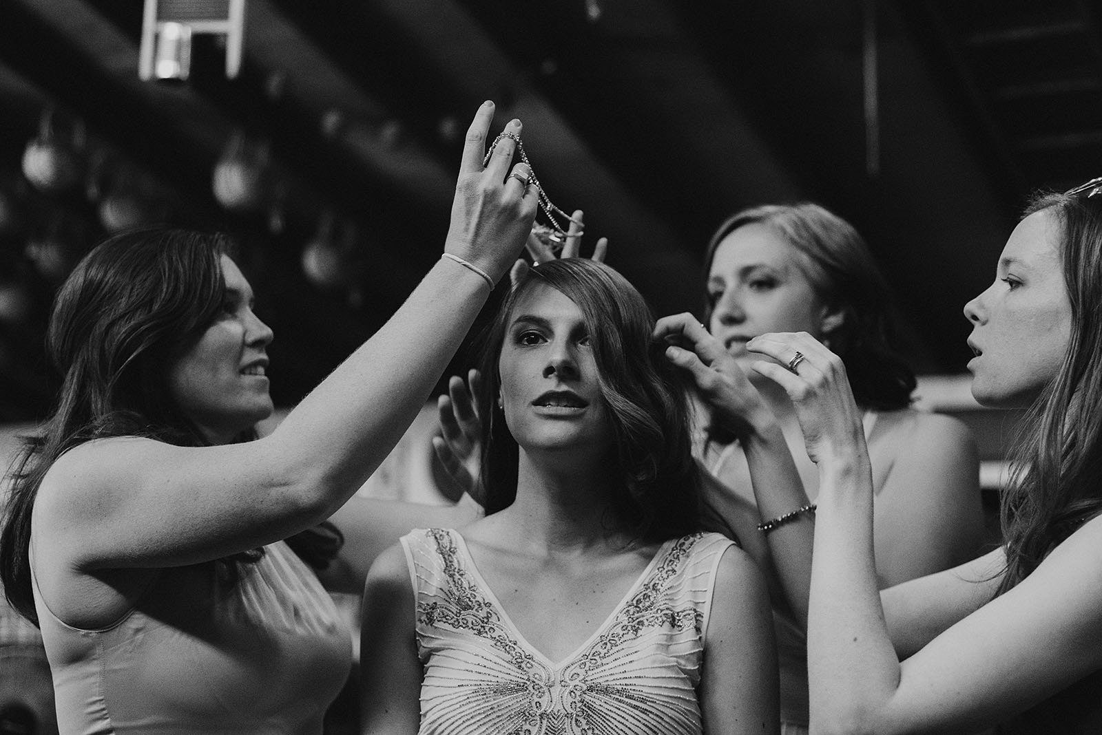 Bride getting ready in a barn | Woodsy Campground Wedding