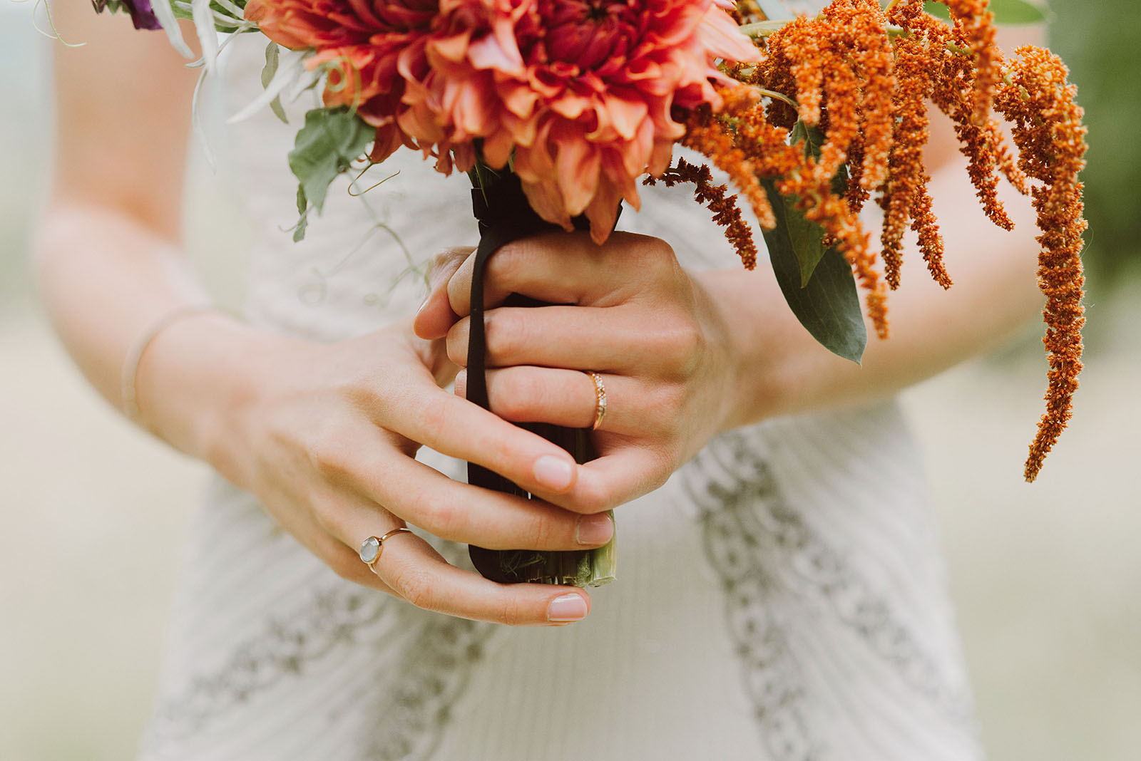 Bride's bouquet and wedding rings | Woodsy Campground Wedding