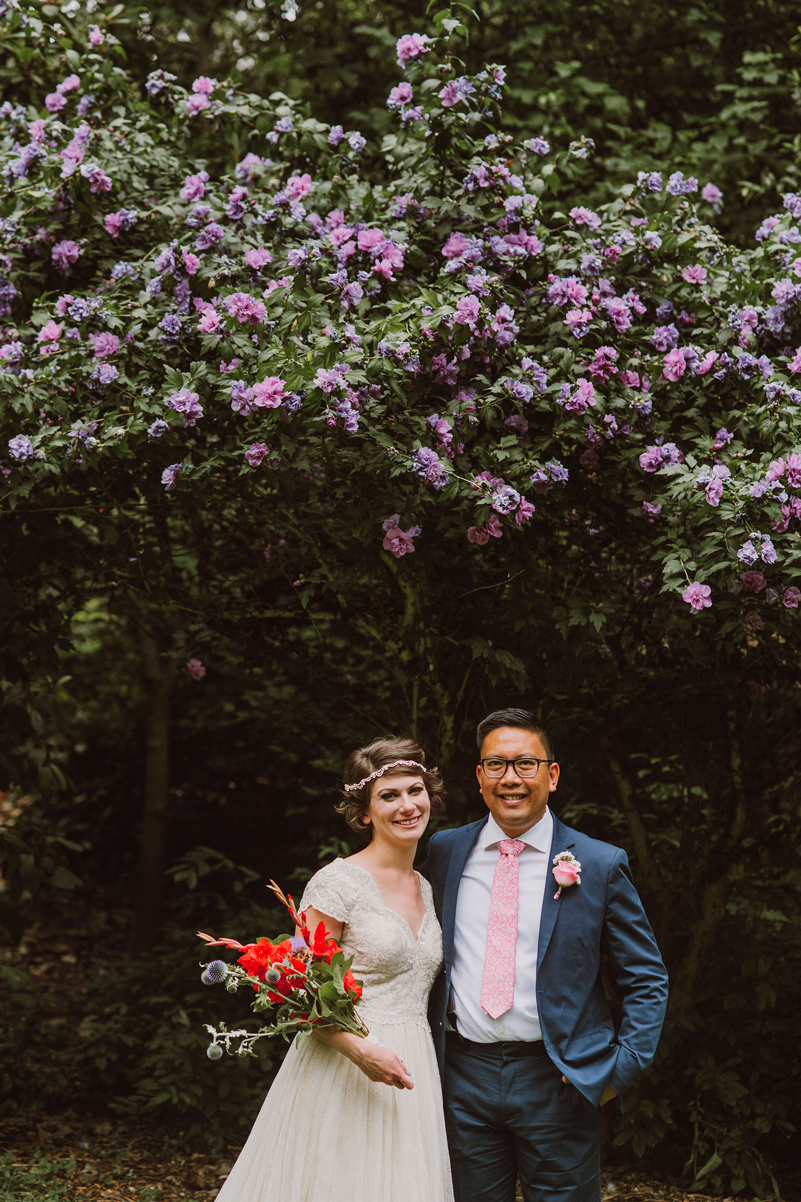 Bride and Groom portrait with blooming flowers in Laurelhurst Park | Downtown Portland Elopement