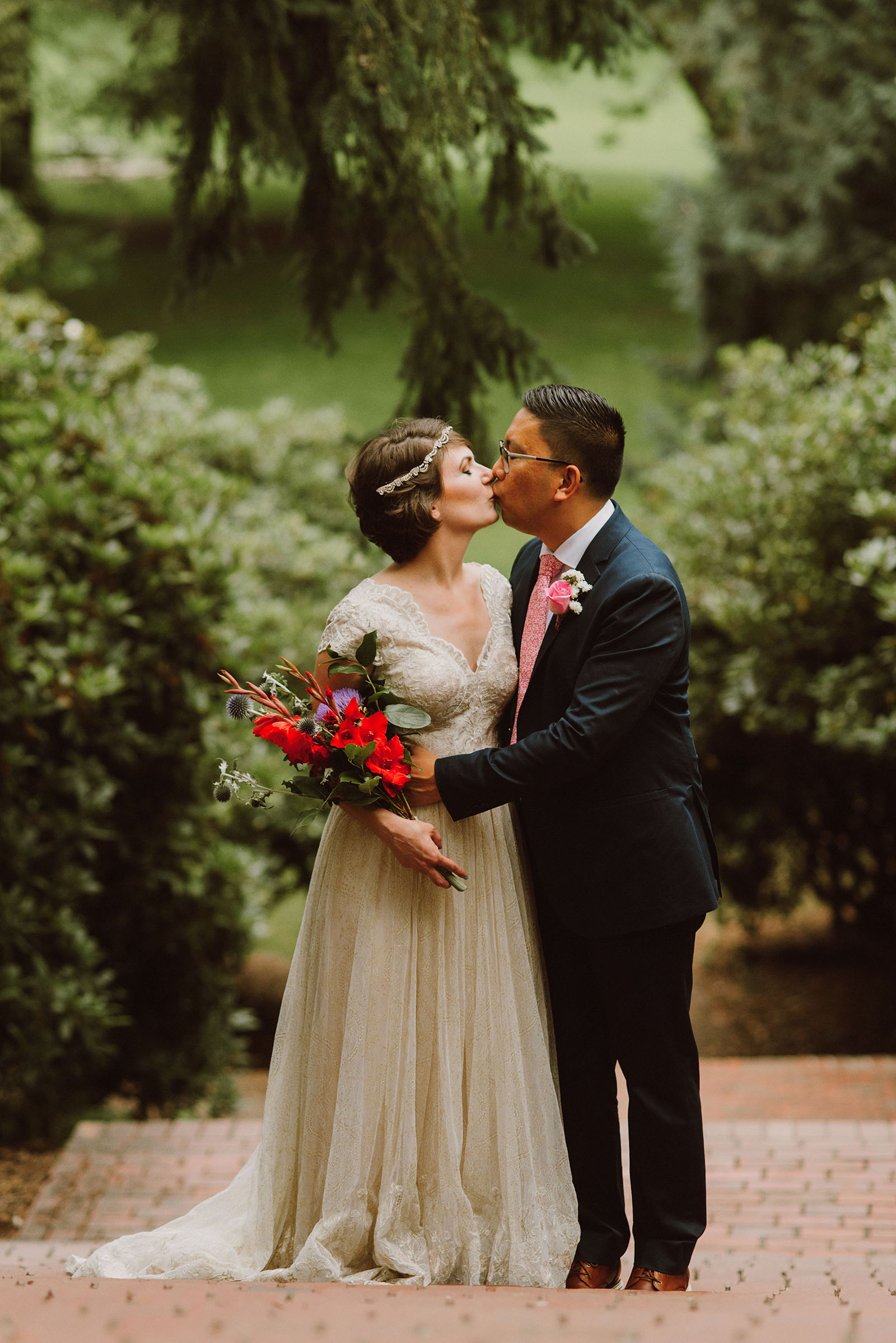 Bride and Groom kissing on the steps in Laurelhurst Park | Downtown Portland Elopement