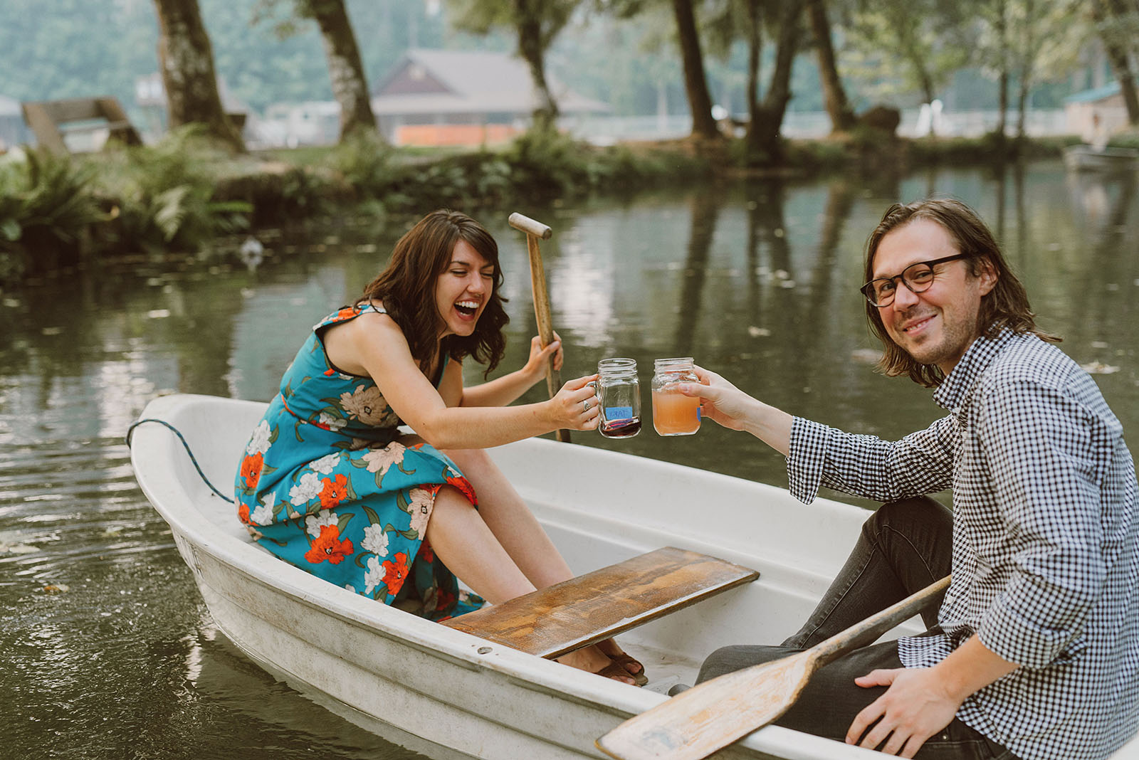 Camp Namanu wedding guests toasting in a boat