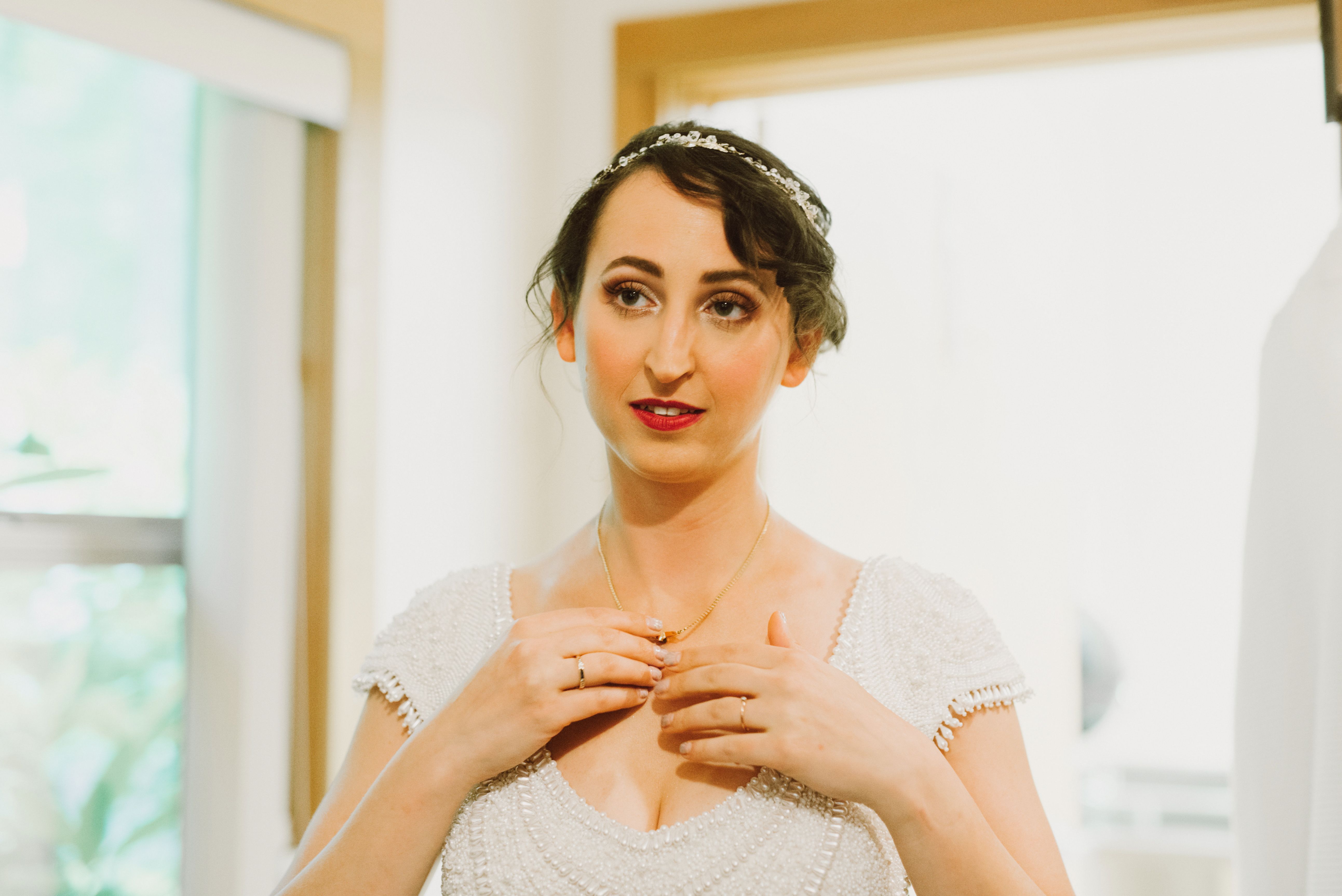 Bride getting ready in the cabins at Camp Angelos wedding