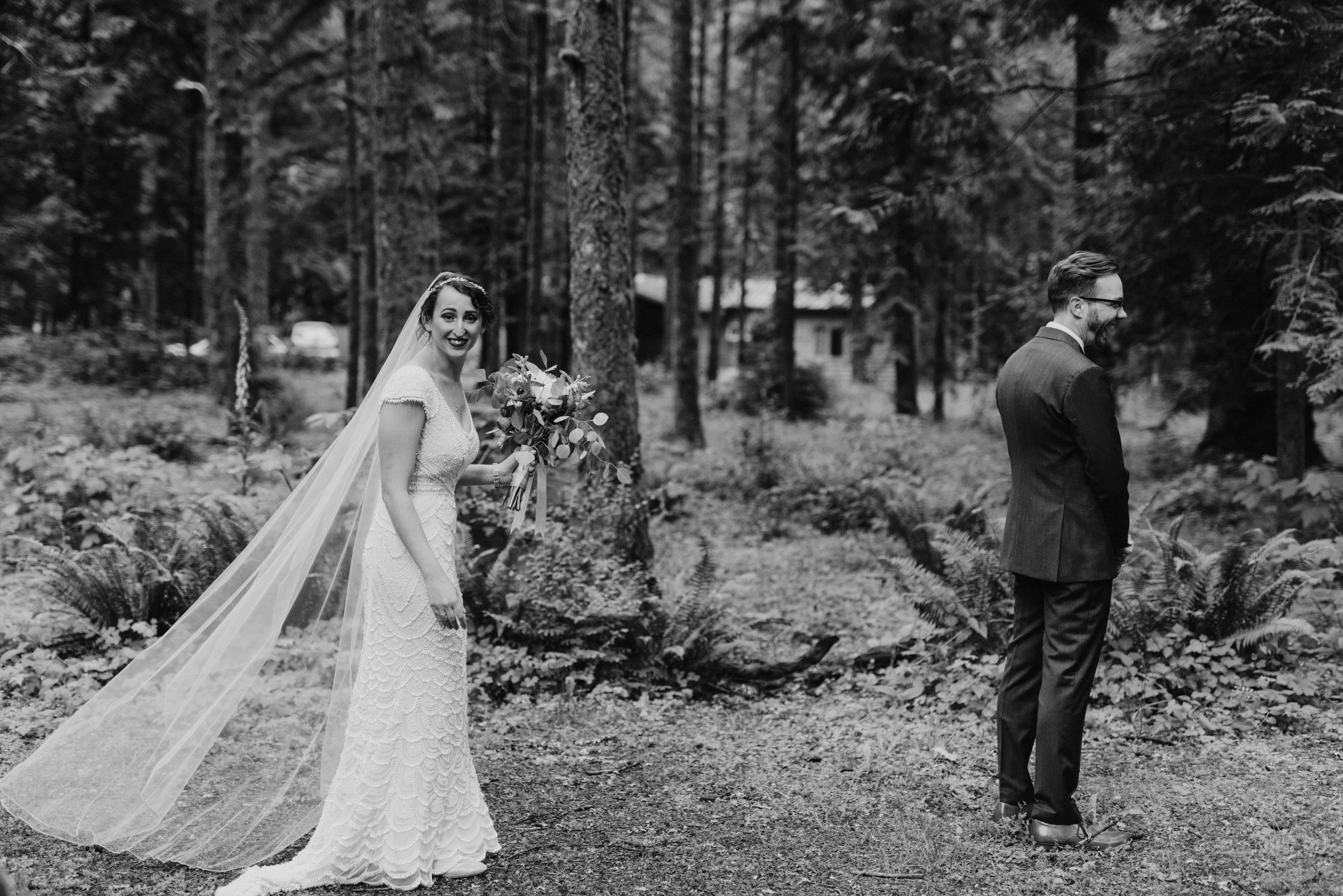 Bride and Groom's first look in the forest at Camp Angelos wedding