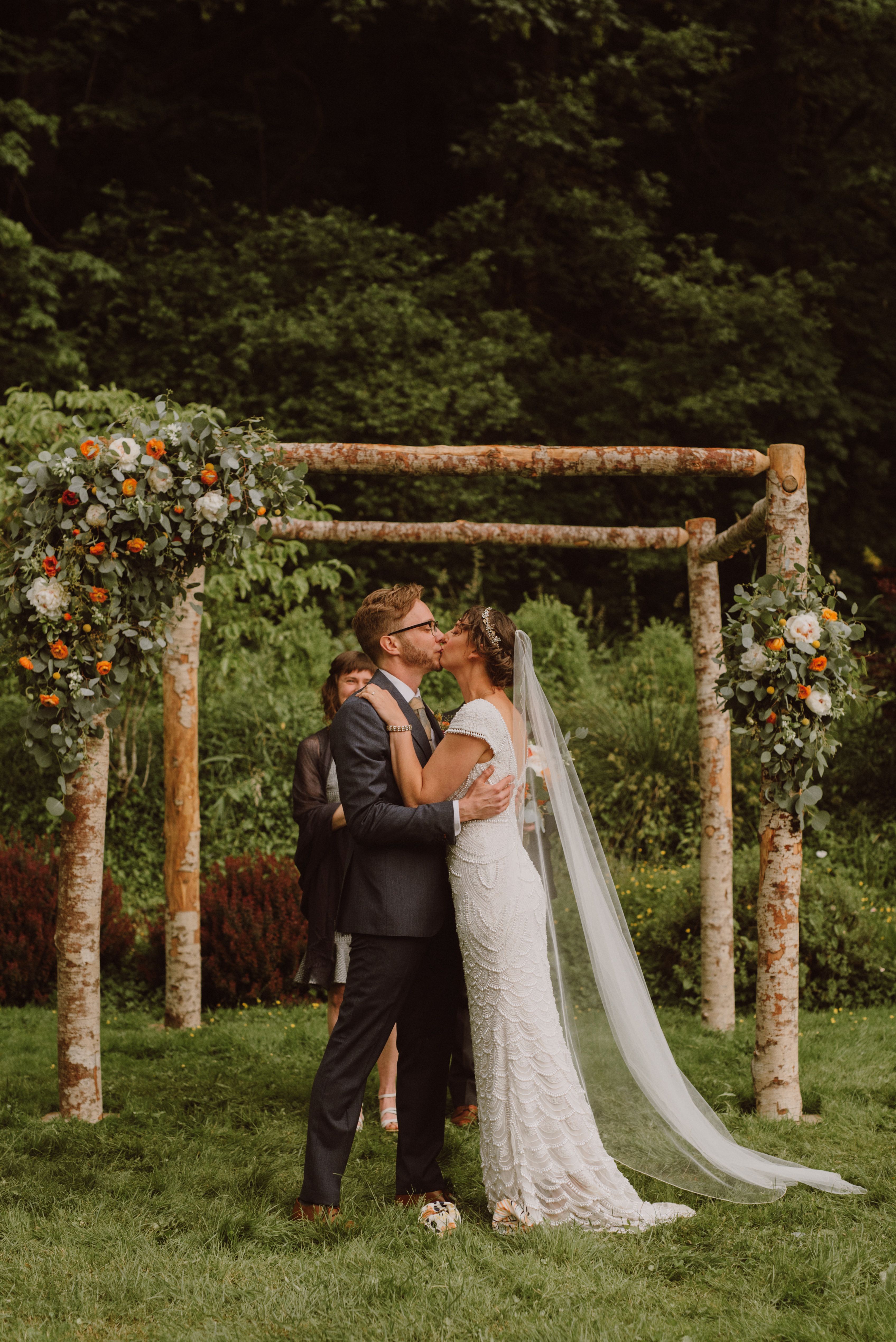 Bride and Groom's first kiss at Camp Angelos wedding