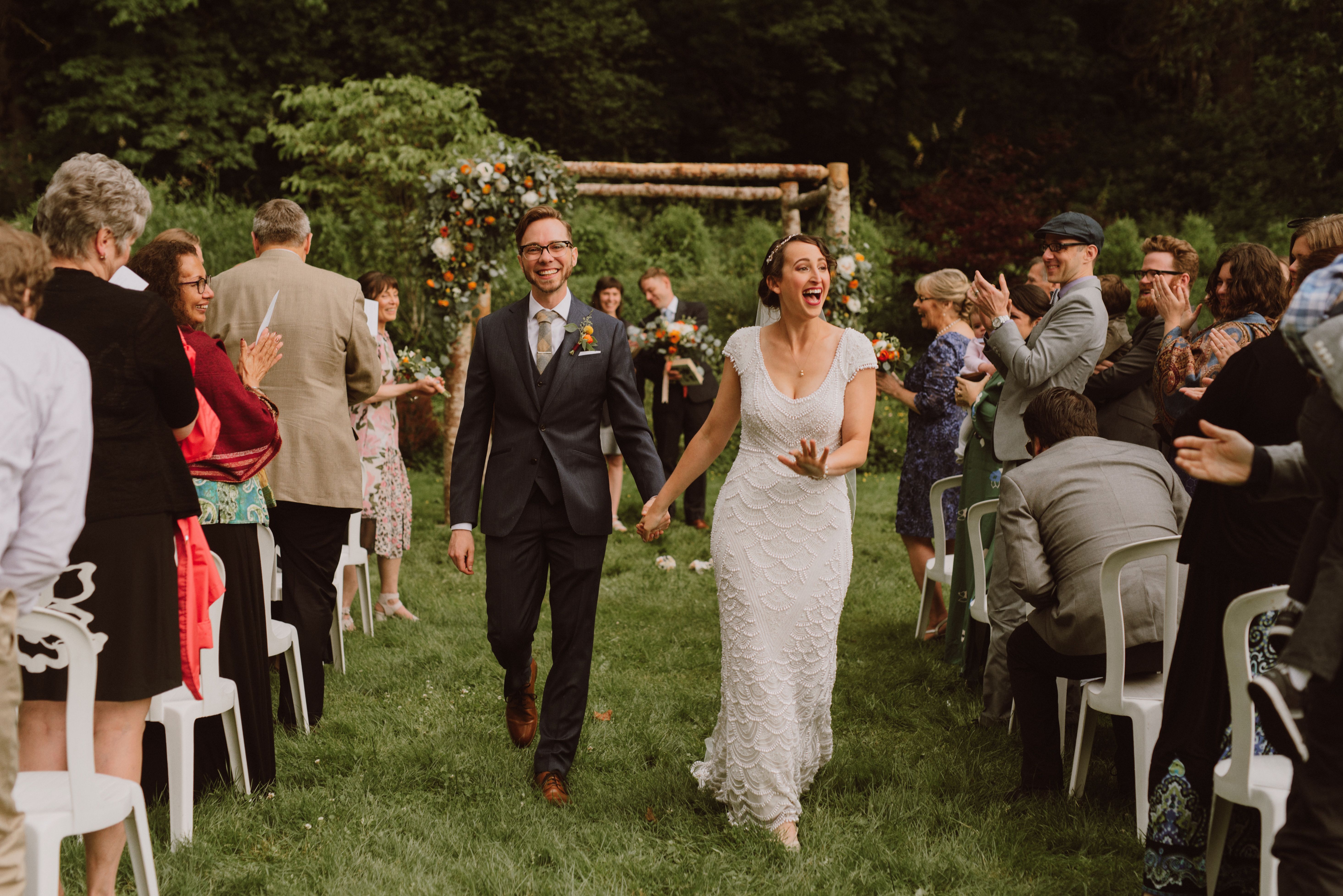 Newlyweds walking down the aisle at Camp Angelos