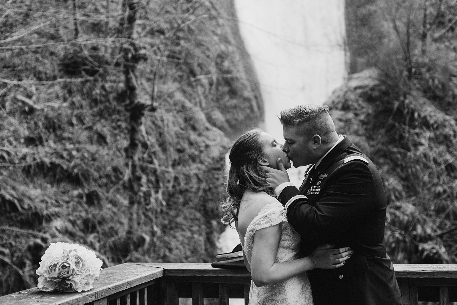 bride and groom's first kiss at bridal veil falls - Portland Wedding photography
