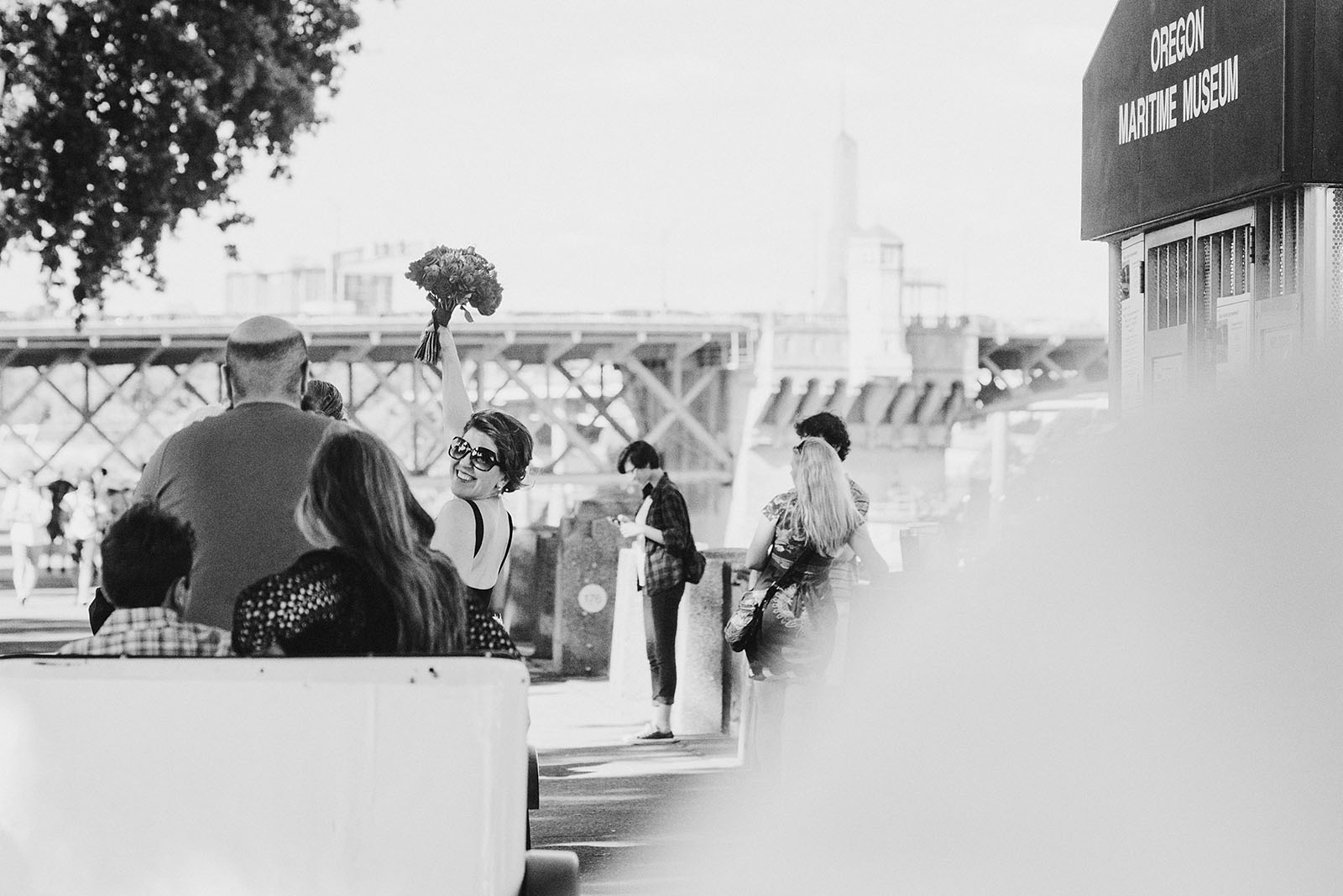 Bride and Groom riding pedicabs to their Ecotrust Wedding