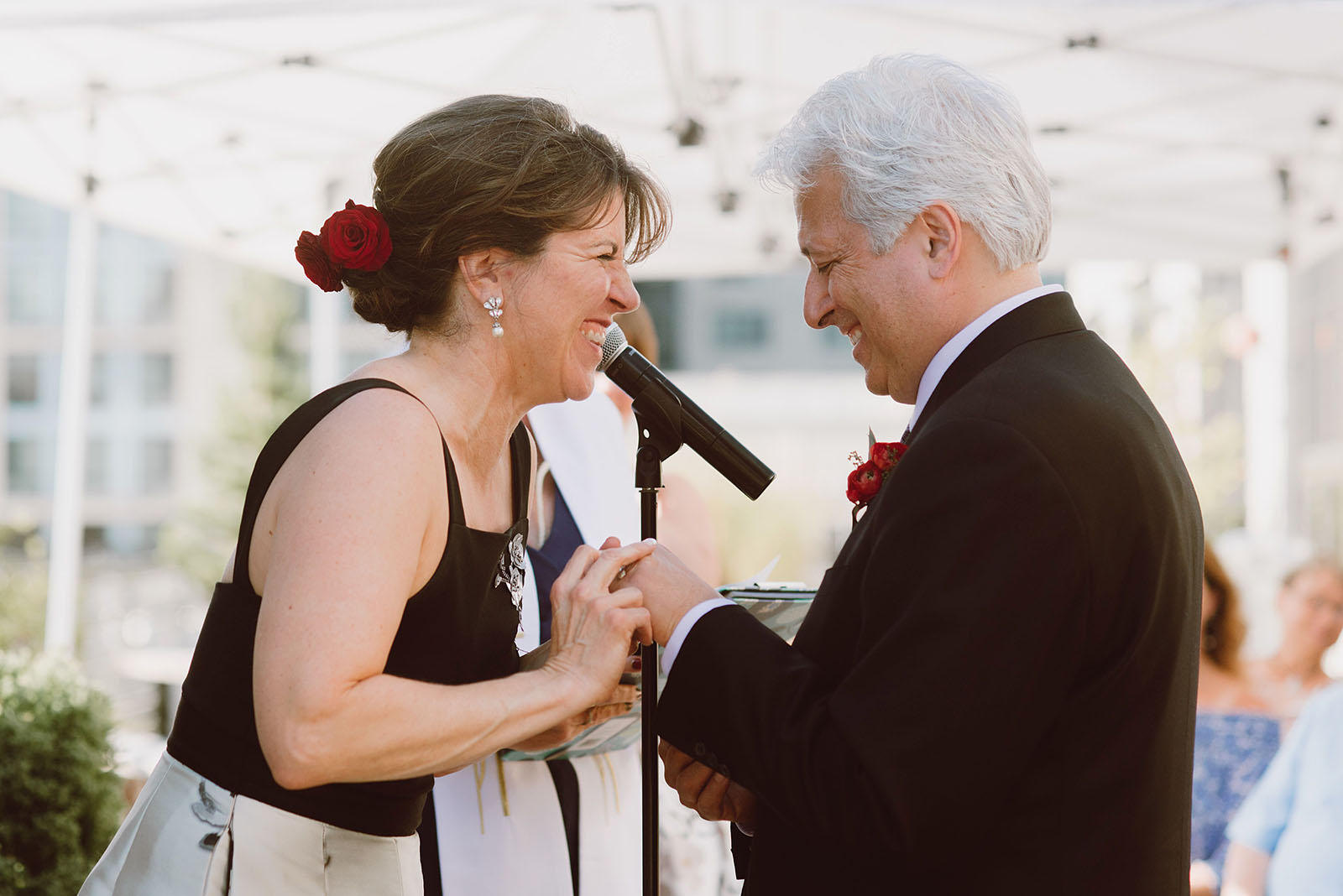 Bride and Groom laughing during their Ecotrust Wedding ceremony