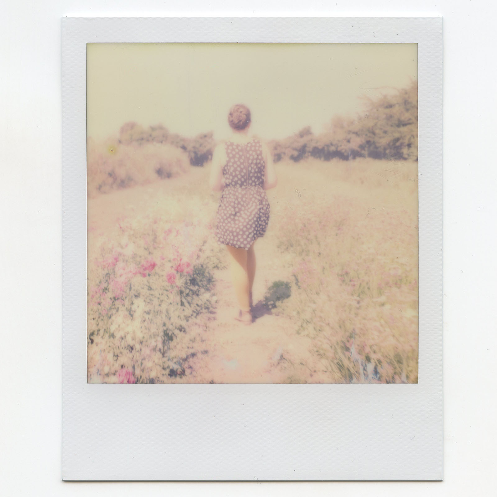 Polaroid of woman walking in a farm in Humboldt County, CA