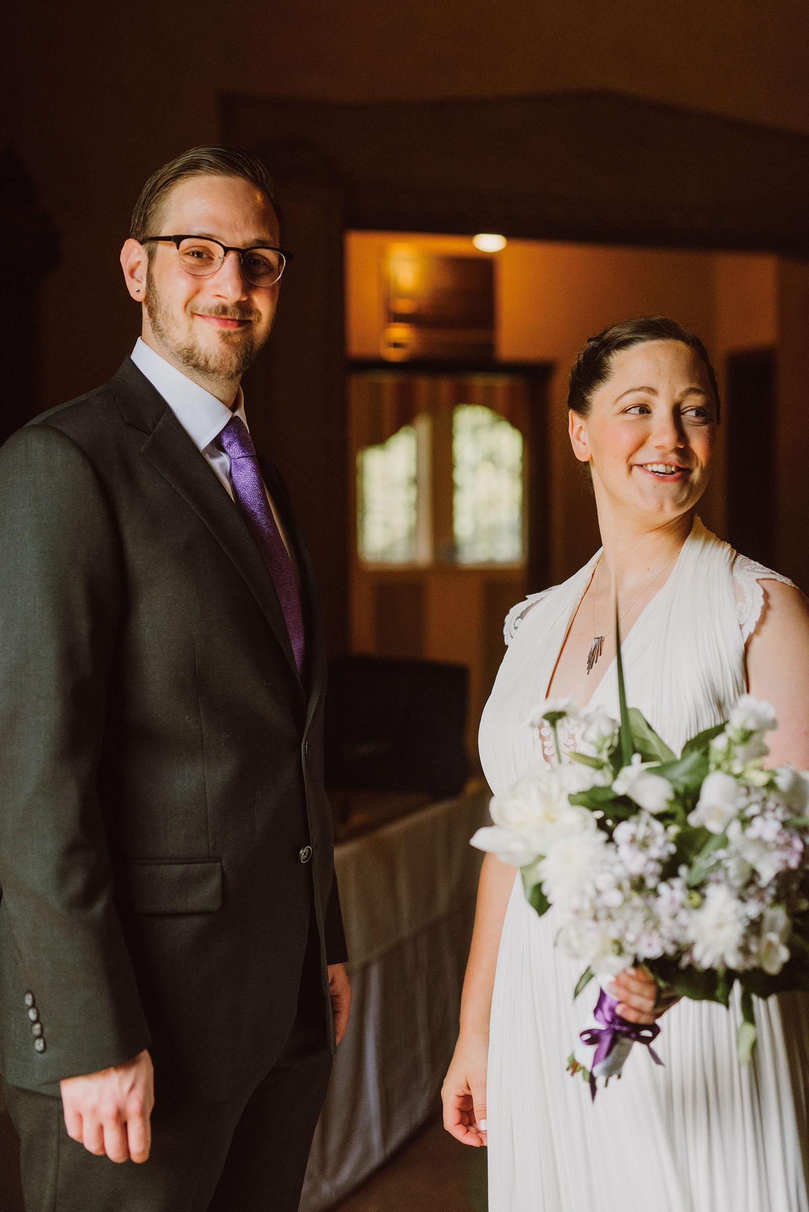 Bride and Groom greeting guests at their Congregation Beth Israel wedding