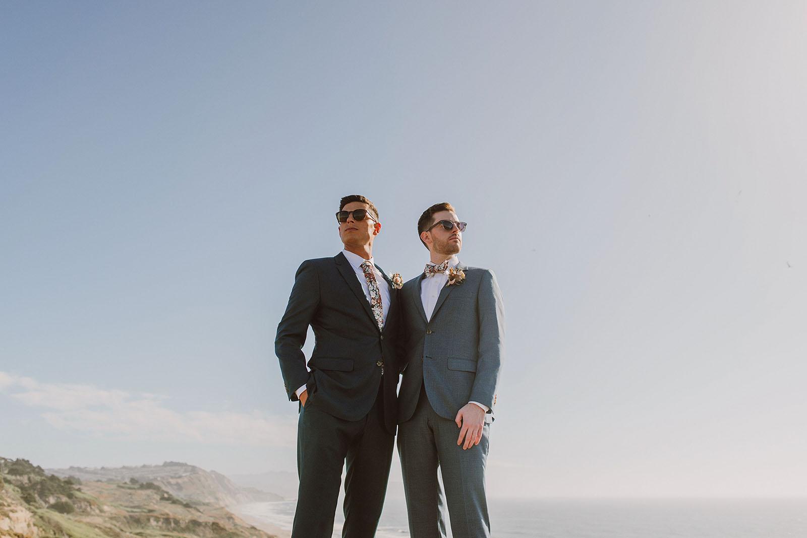 Grooms posing on the cliffs at Fort Funston - Foreign Cinema Wedding